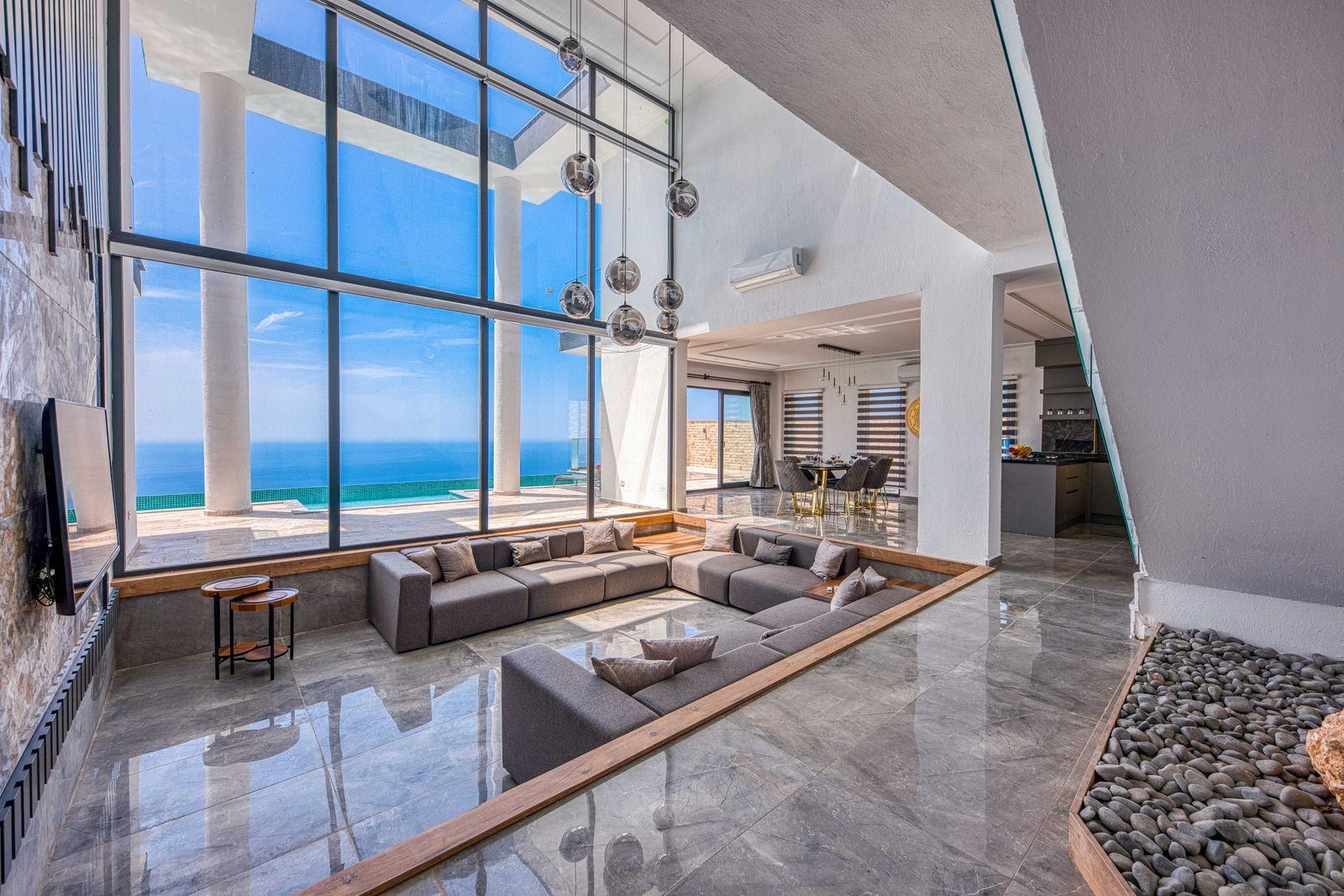 Clean, light-filled Newport Coast hilltop estate interior with ocean-view glass